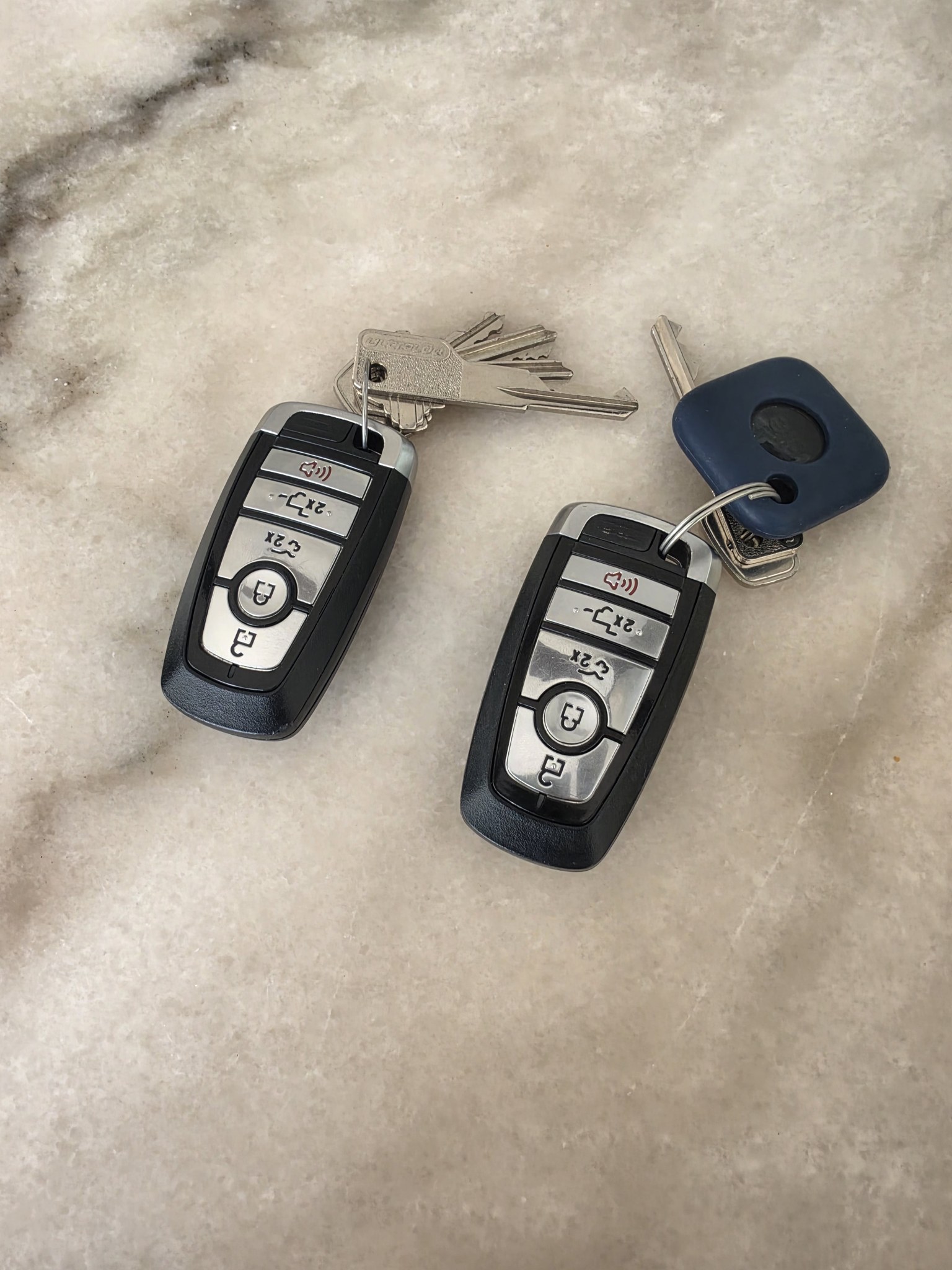 Two key fobs and valet key